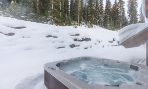 Private hot tub overlooking snow-covered slopes in Big Sky, Montana