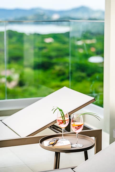 Reserva Conchal penthouse private pool area with lounge chair overlooking the pacific