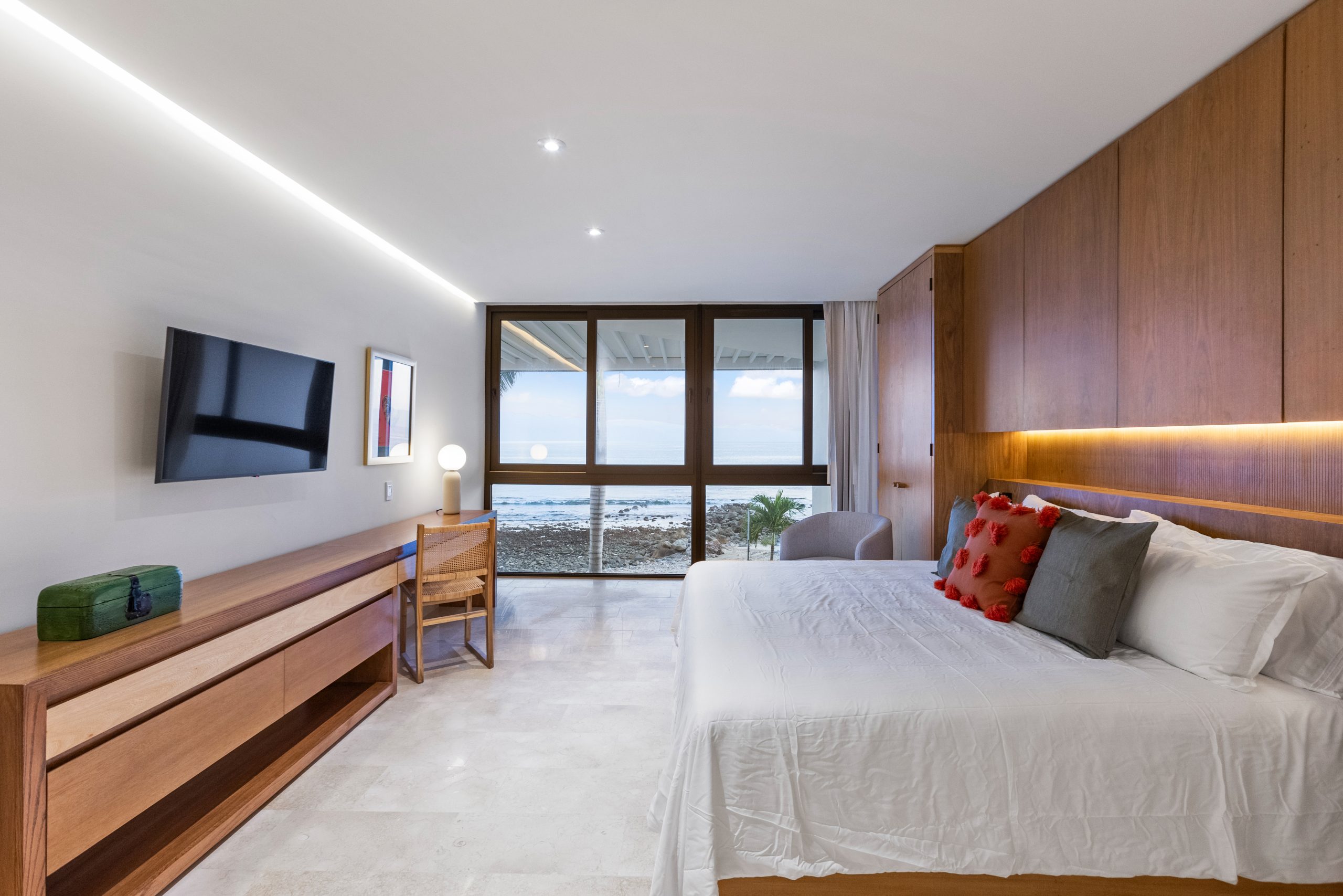 Modern luxury villa in Nuevo Vallarta, Mexico featuring contemporary architecture, private pool, and tropical garden views near the beach.