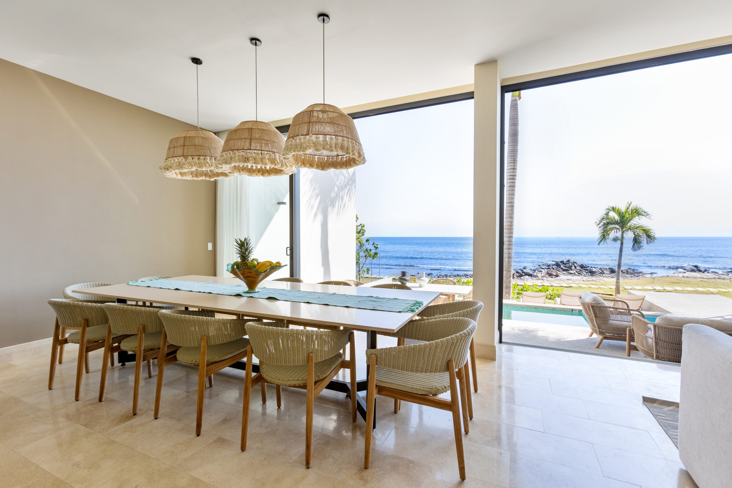 Modern luxury villa in Nuevo Vallarta, Mexico featuring contemporary architecture, private pool, and tropical garden views near the beach.