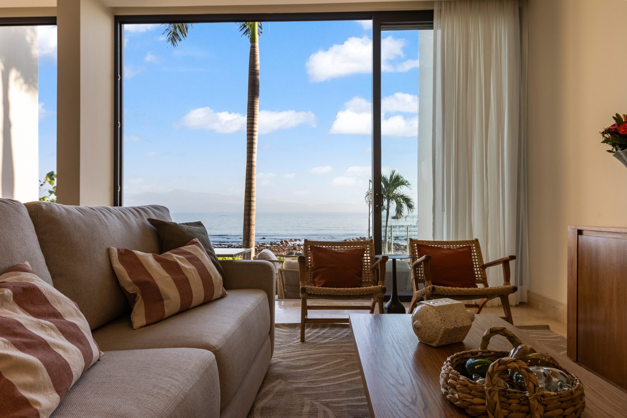 Modern luxury villa in Nuevo Vallarta, Mexico featuring contemporary architecture, private pool, and tropical garden views near the beach.