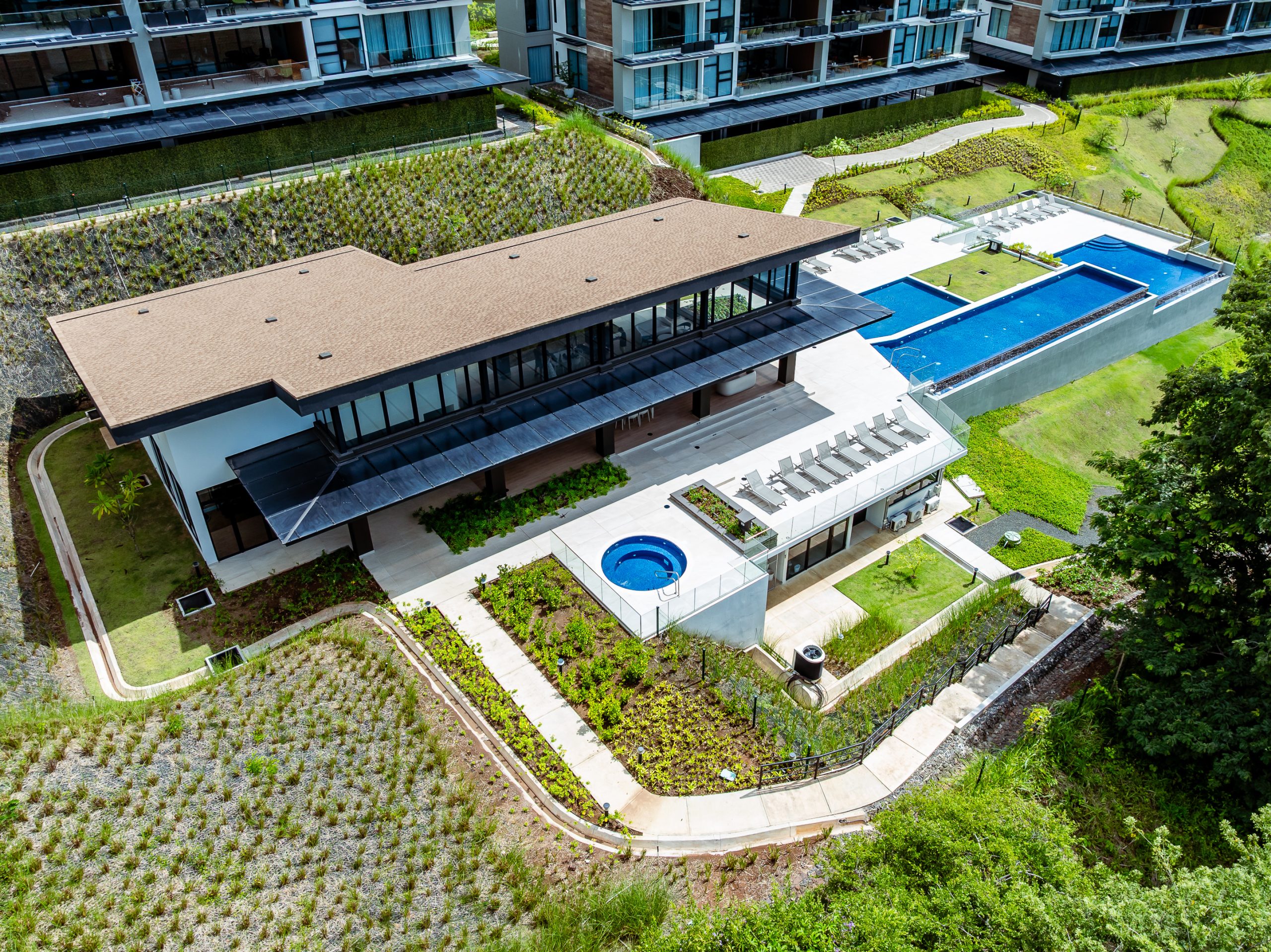 Reserva Conchal clubhouse including a luxury pool, dining areas, and lush tropical surroundings for guests to enjoy