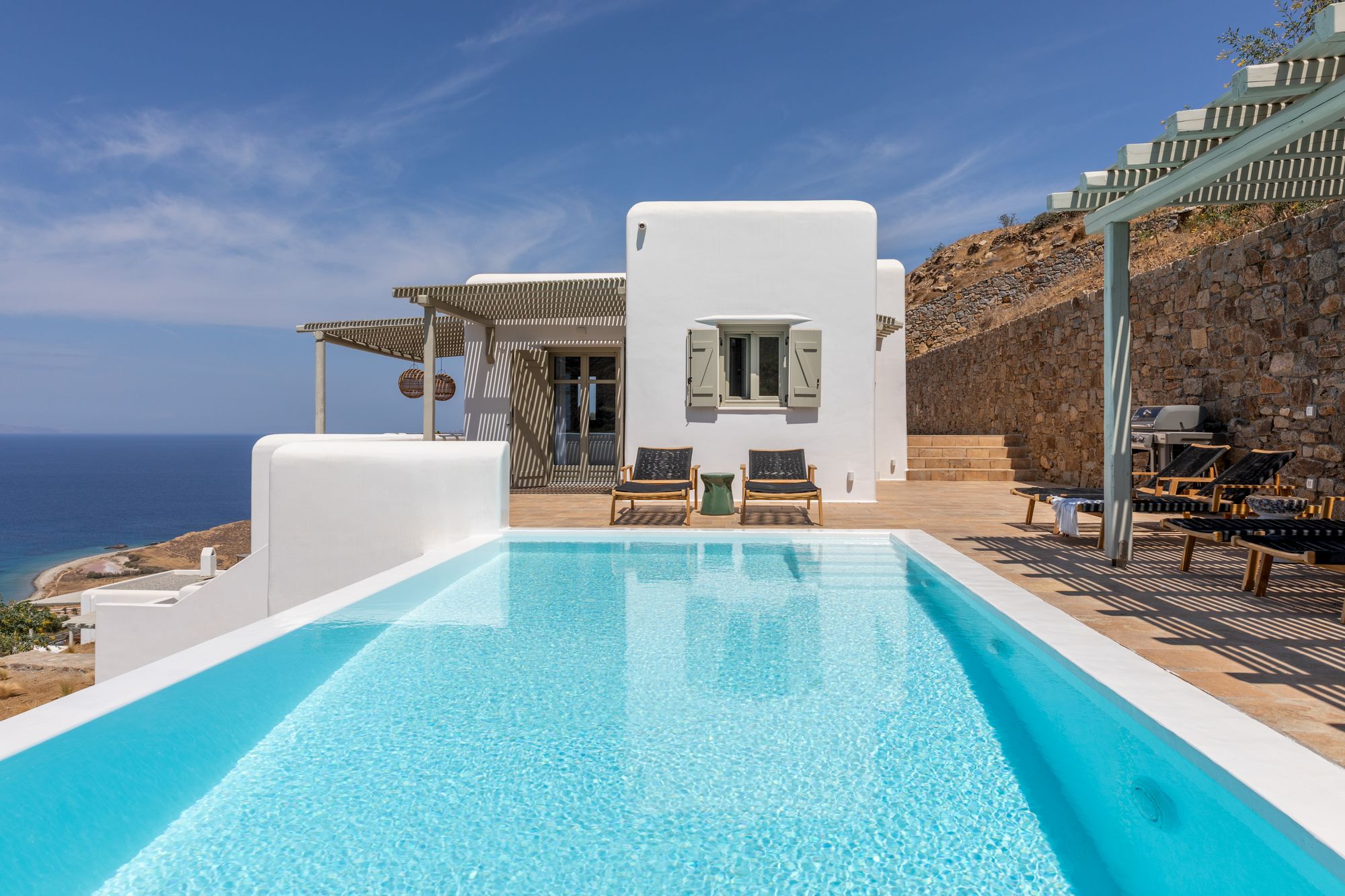 A private pool at a luxury villa in Mykonos with a stunning view of the Aegean sea